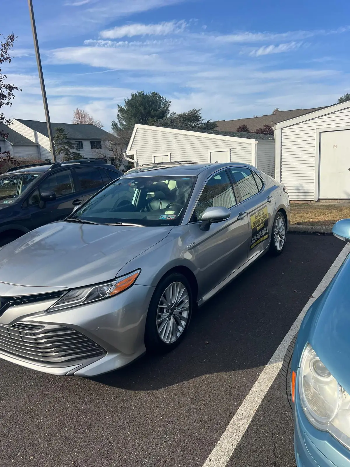 Front view of the silver dual-control Camry used for lessons and road tests