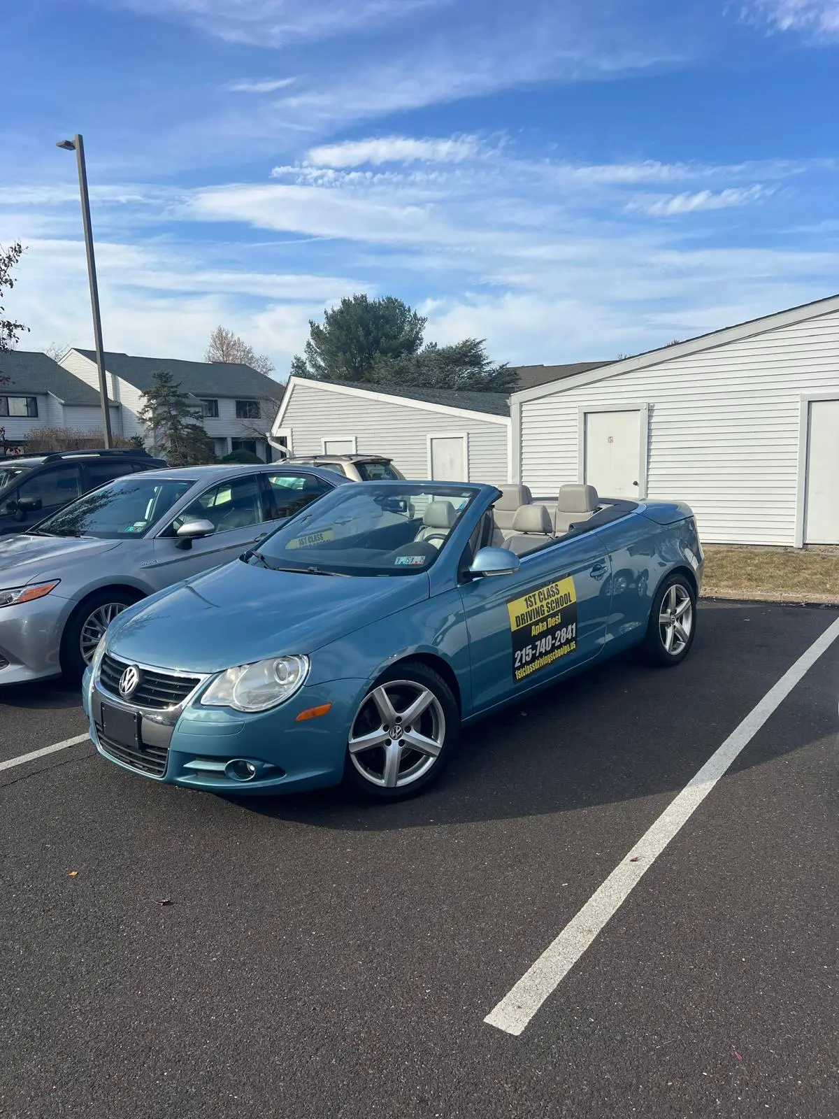Light blue convertible training car under a clear Pennsylvania sky