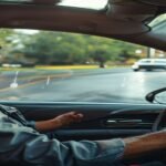 Driver demonstrating defensive driving techniques on a Pennsylvania road, emphasizing safe driving and accident prevention for a defensive driving course PA.